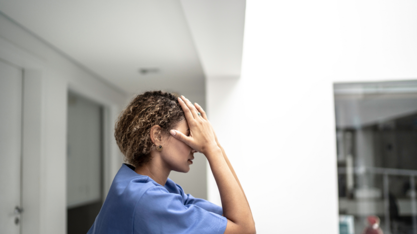 A nurse looking exhausted